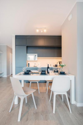 72m2 Manufaktura Prestige Suite with Parking by Rentujemy